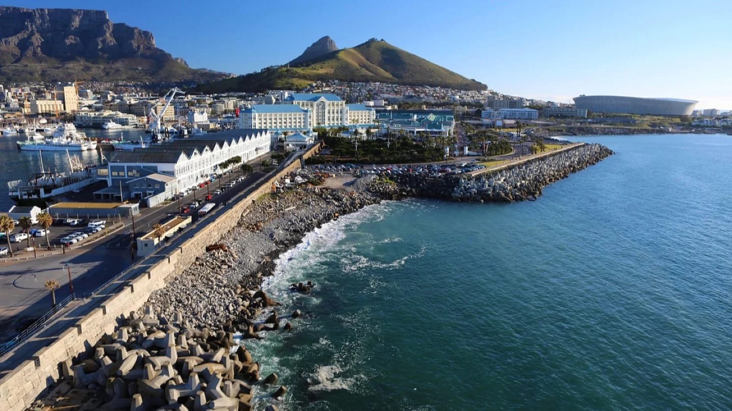 Cape Town’s waterfront and city center extend beneath Table Mountain.