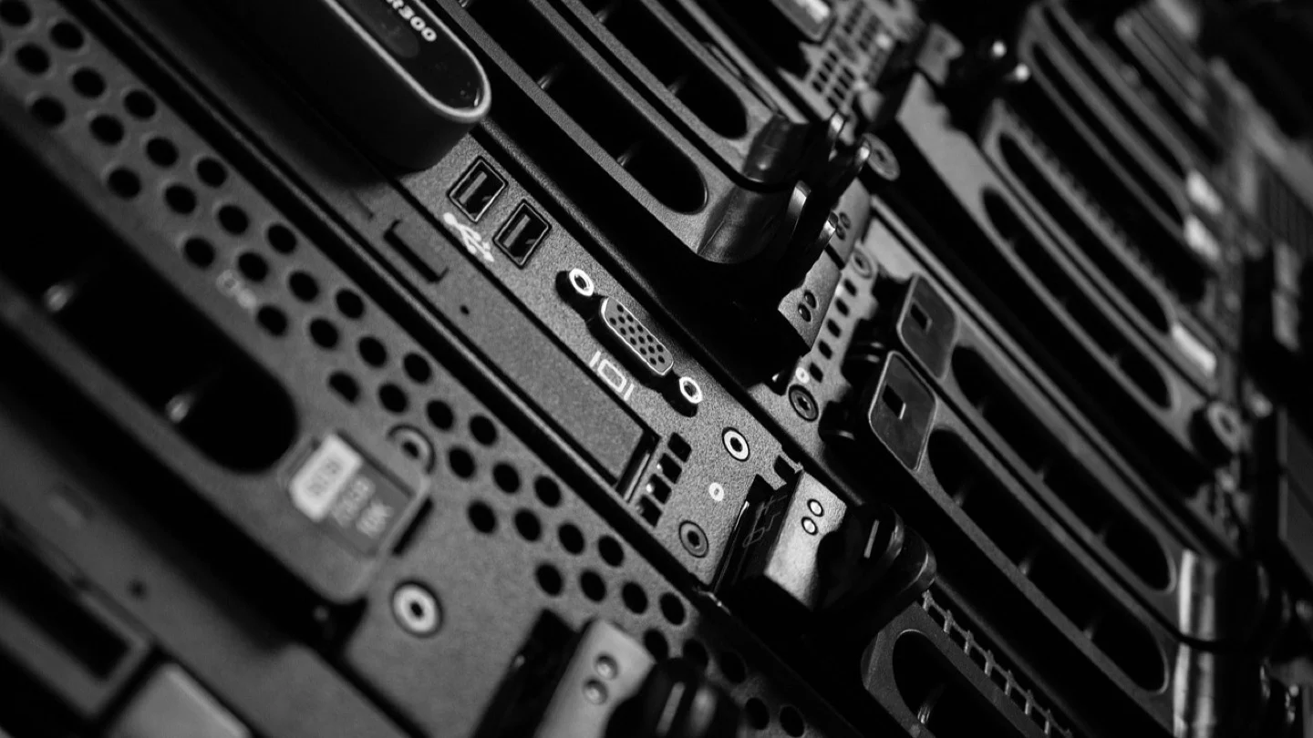 A close view shows ports and components on black data-center servers.