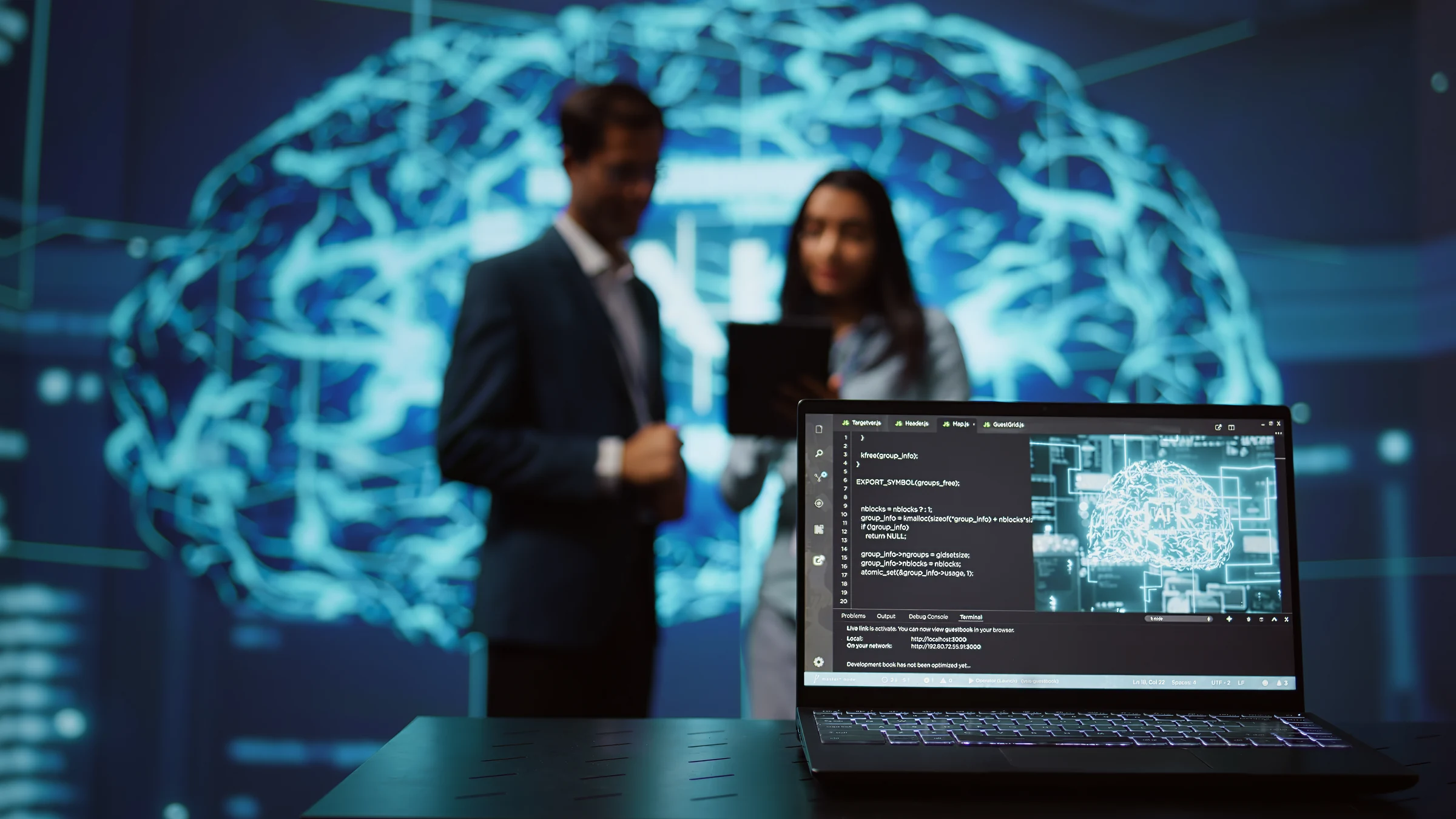 Close view of a laptop used by people working on an artificial-intelligence system.