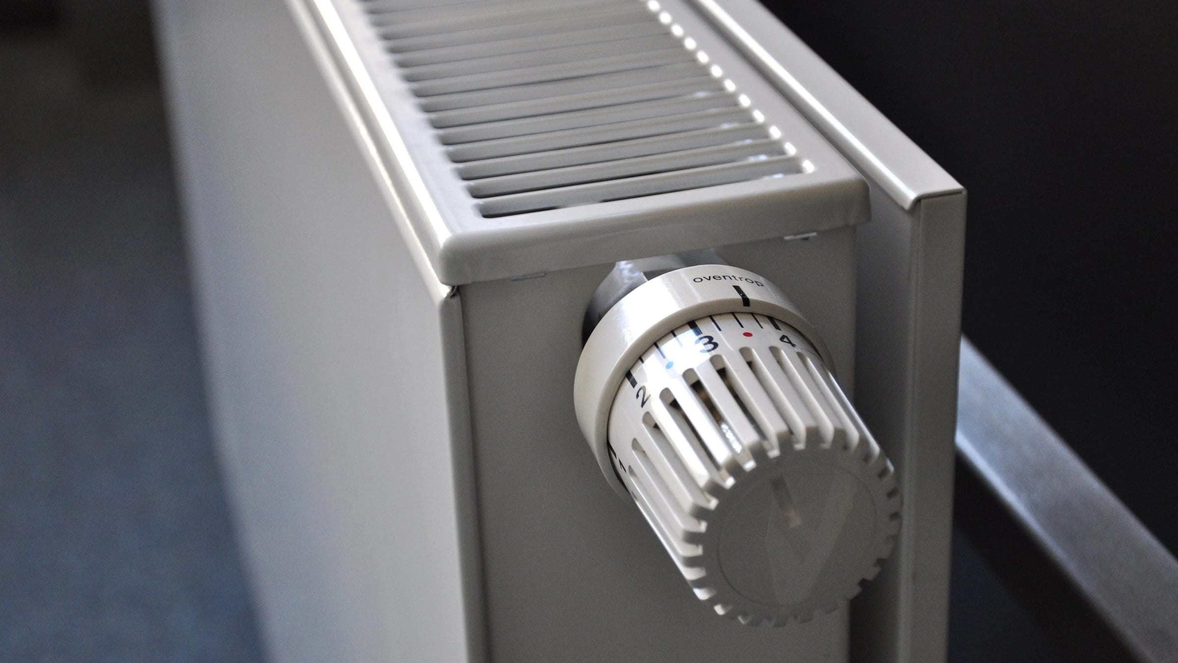 Thermostatic control on a white household radiator