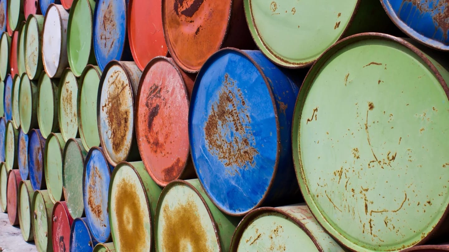 Rows of sealed oil barrels form a dense fuel-storage pattern.