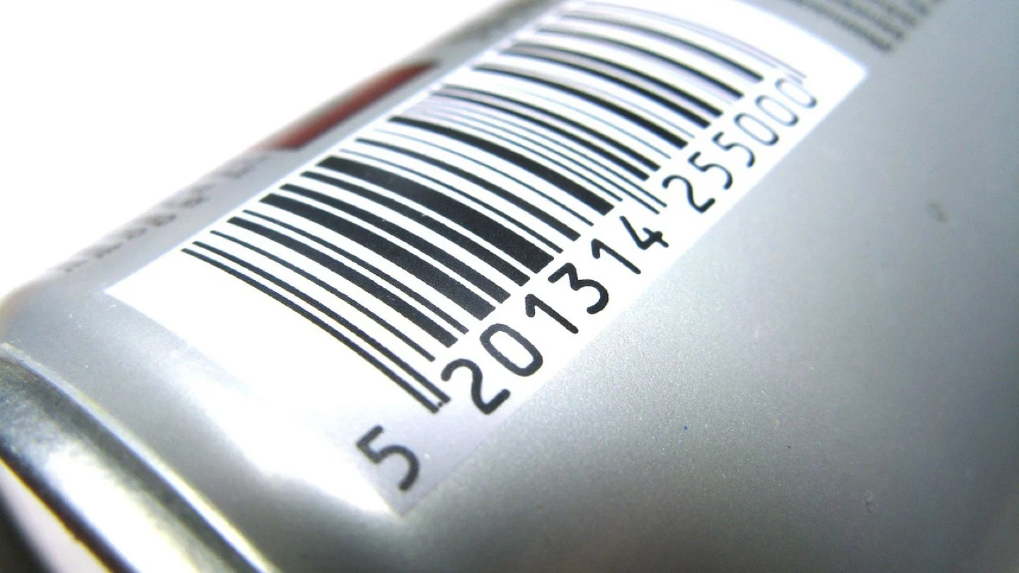 A printed product barcode and identification number fill the side of a packaged item.