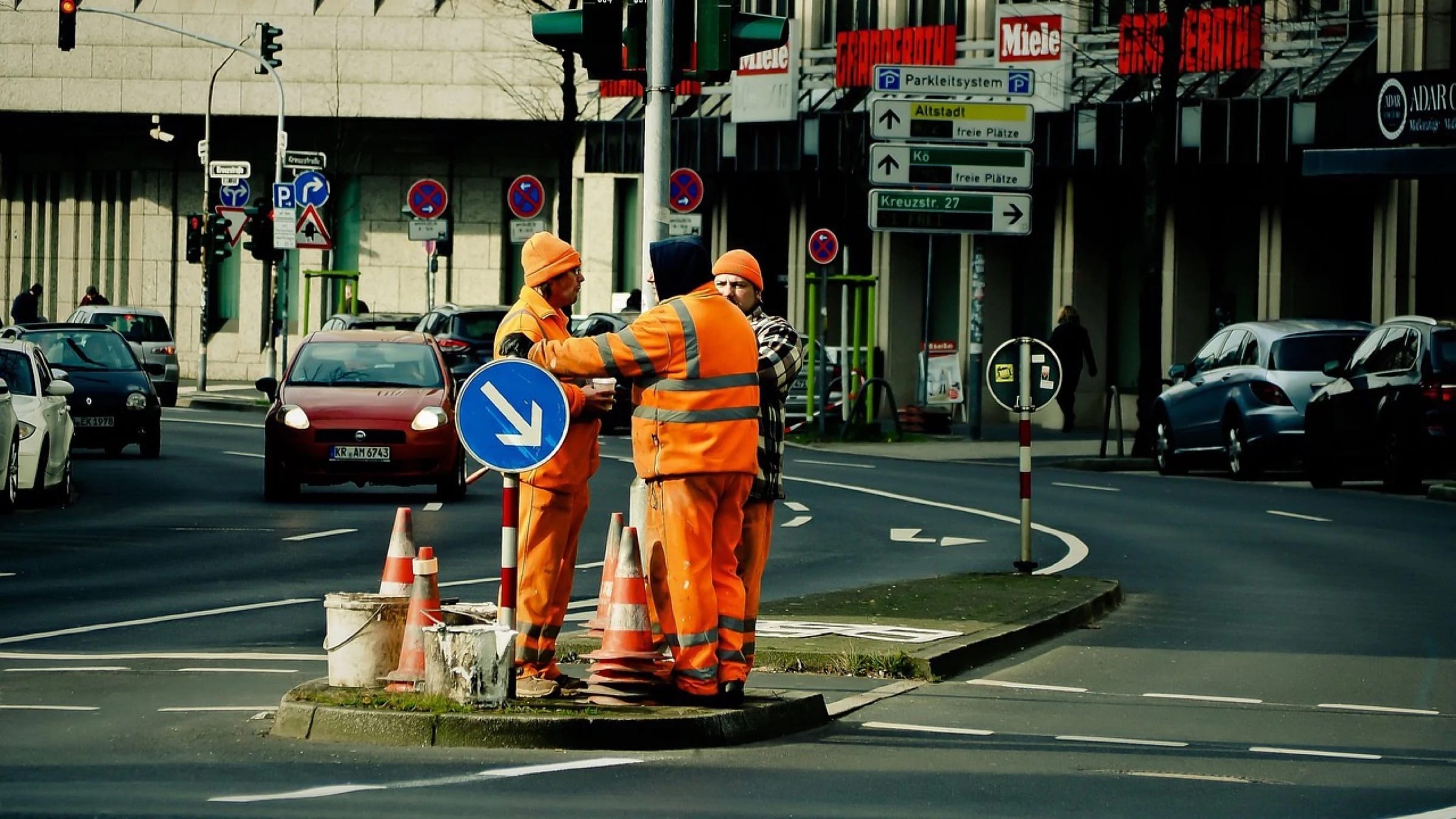 Road workers carrying out construction work together.