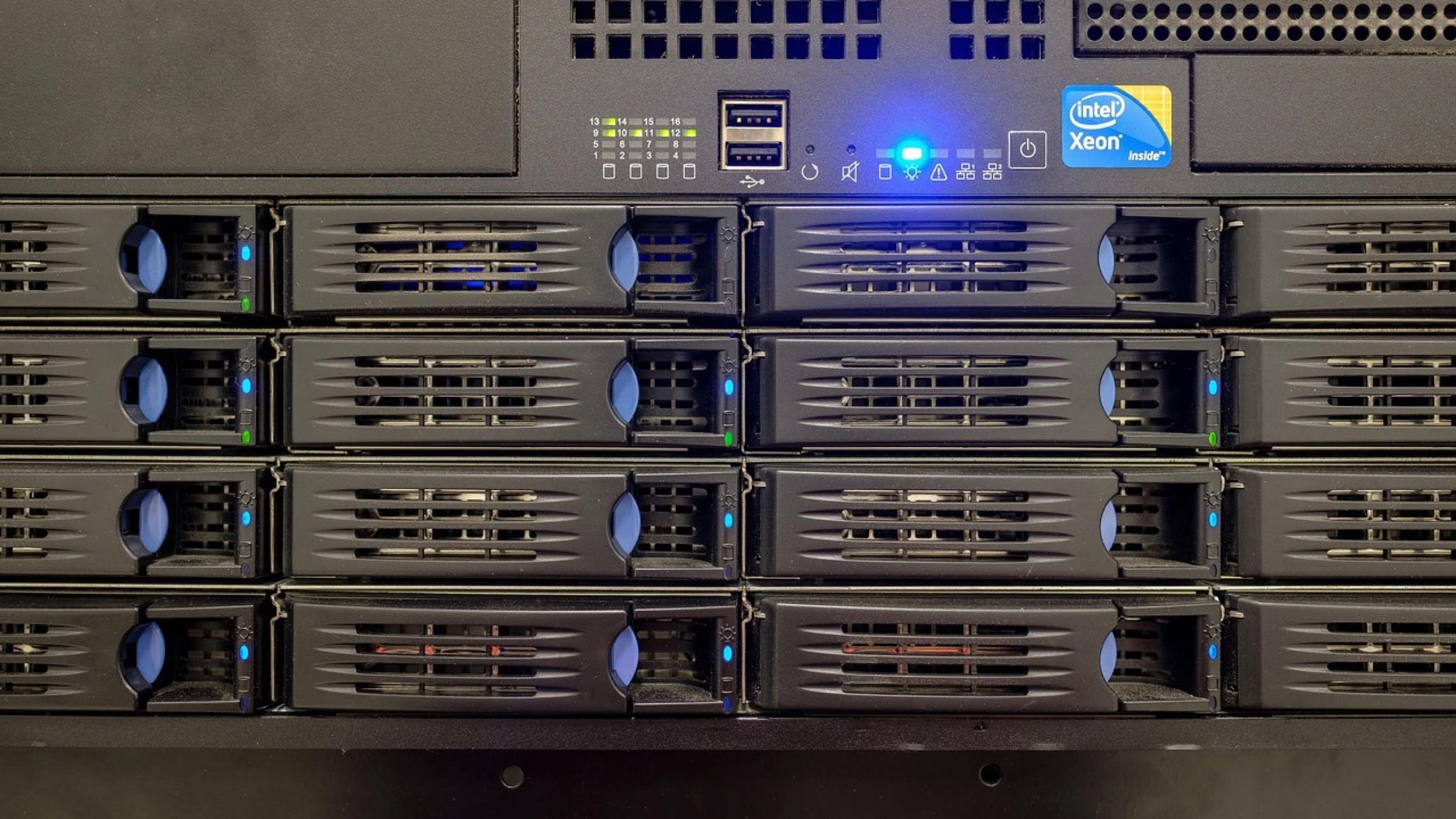 Close view of rack-mounted server hardware and drive bays.