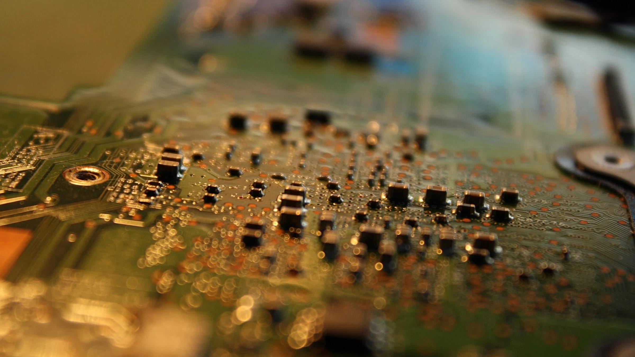 Close-up of components and solder points on an electronic circuit board.