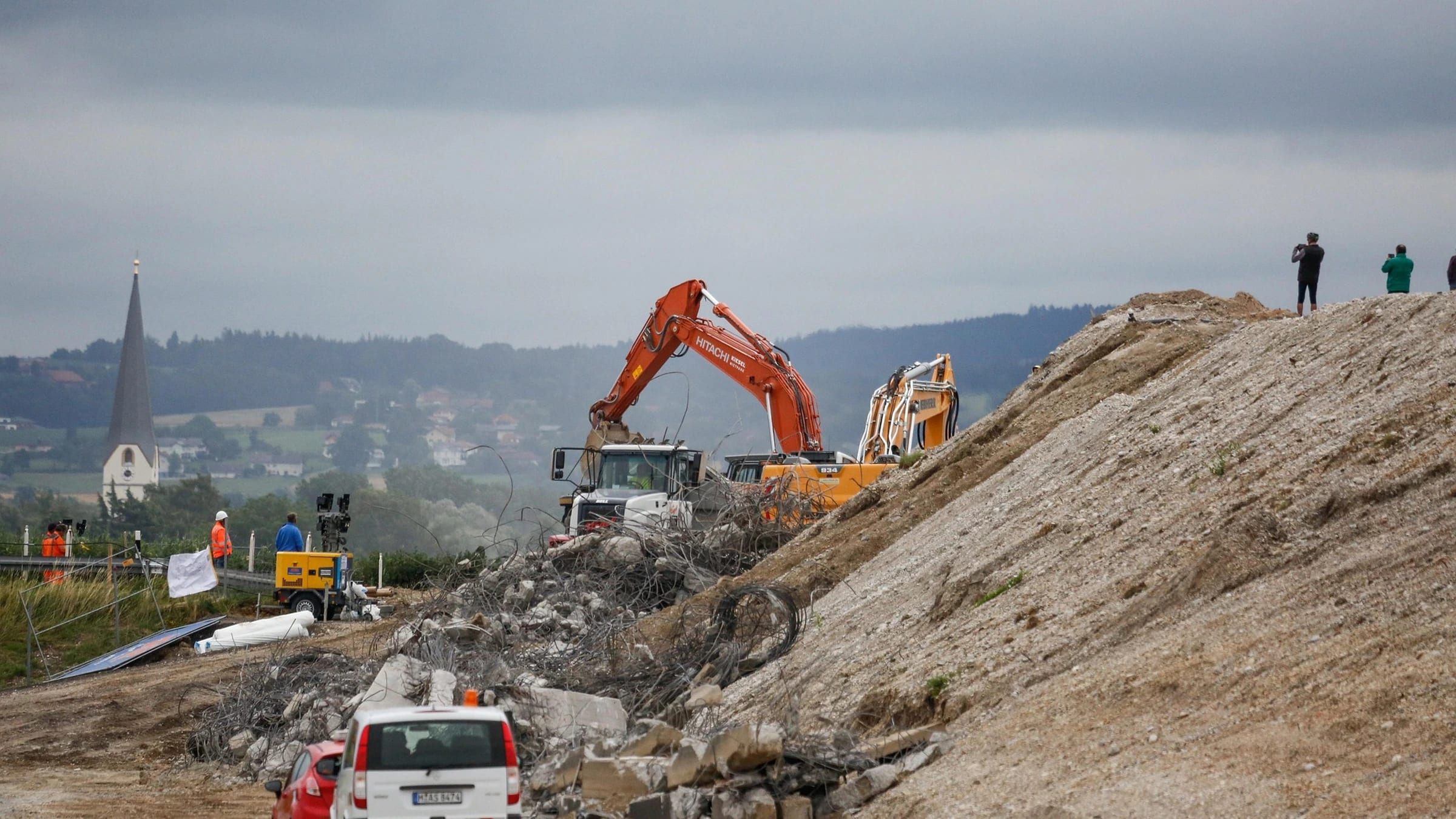 Excavation machinery and roadwork at a construction site.
