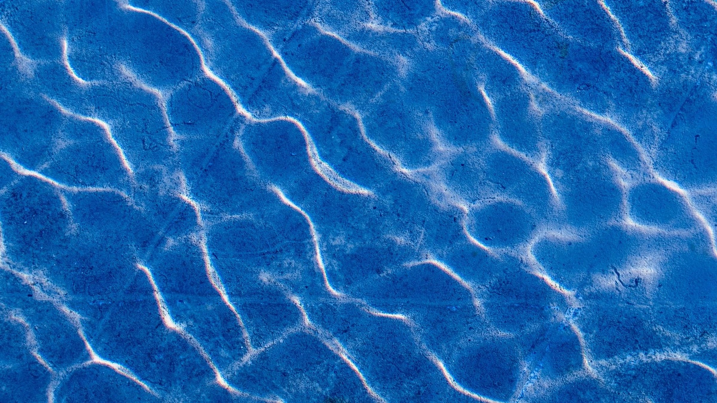Small waves and reflected light across a water surface.