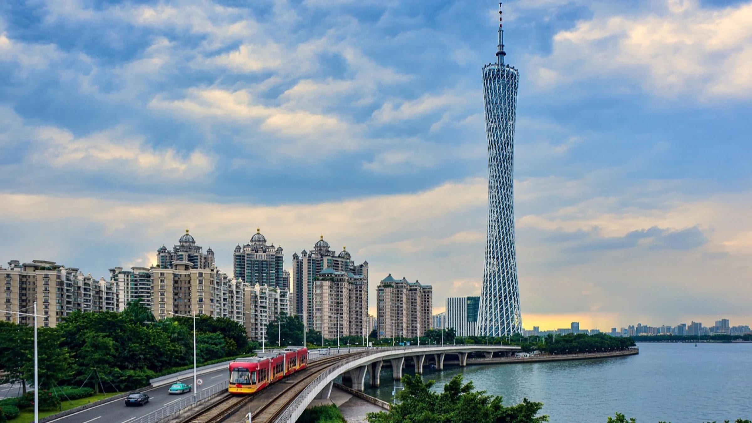 Guangzhou waterfront with the Canton Tower, transport viaduct and river.