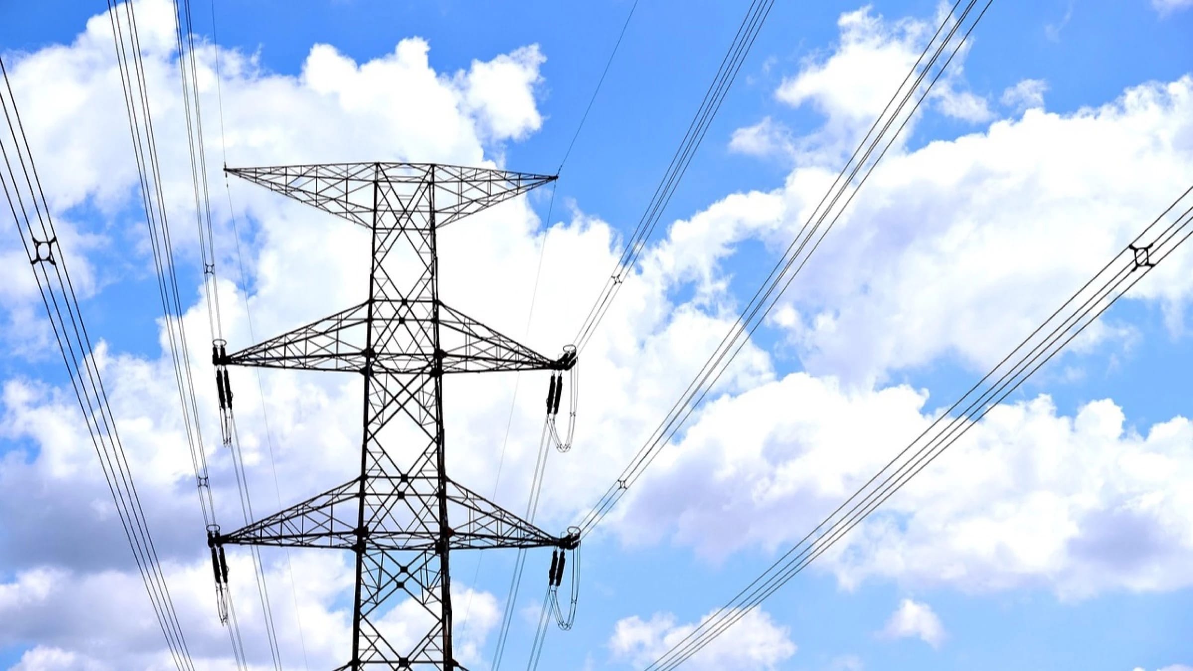 Electricity transmission towers against the sky