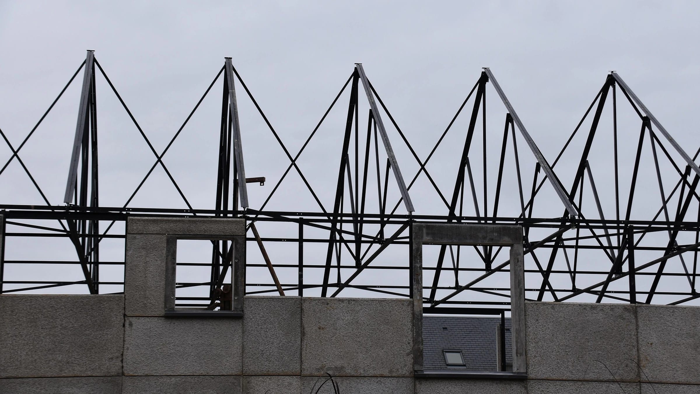 Roof frame above an unfinished house.