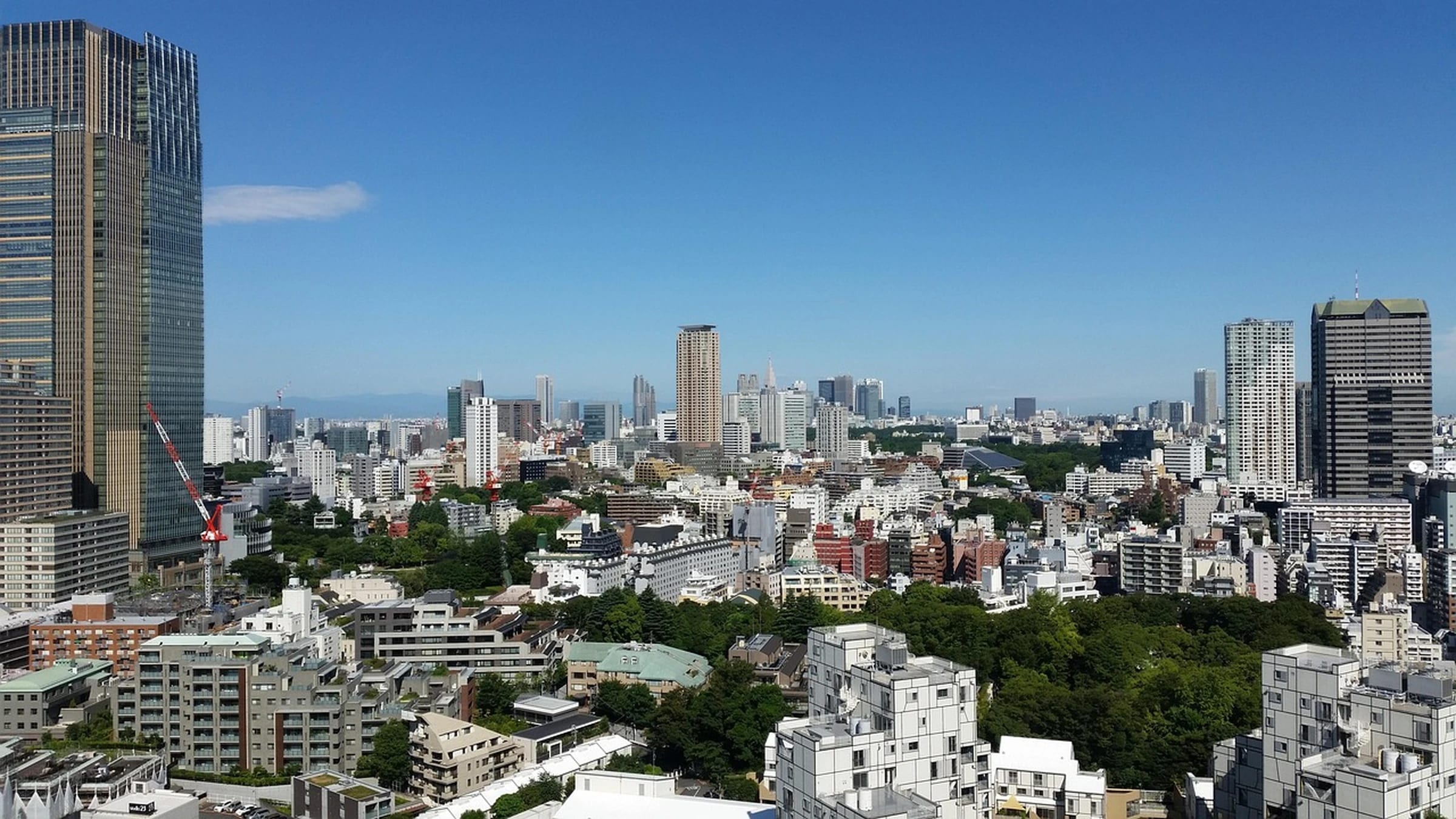 Tokyo buildings and skyline under a blue sky
