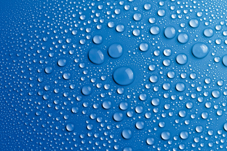 Close-up image of water droplets representing urban water conservation, efficiency standards, and drought resilience measures in California.