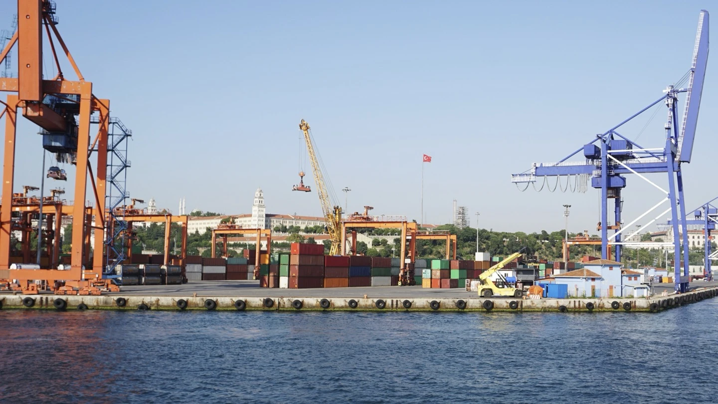 Container cranes and port infrastructure beside a working harbour