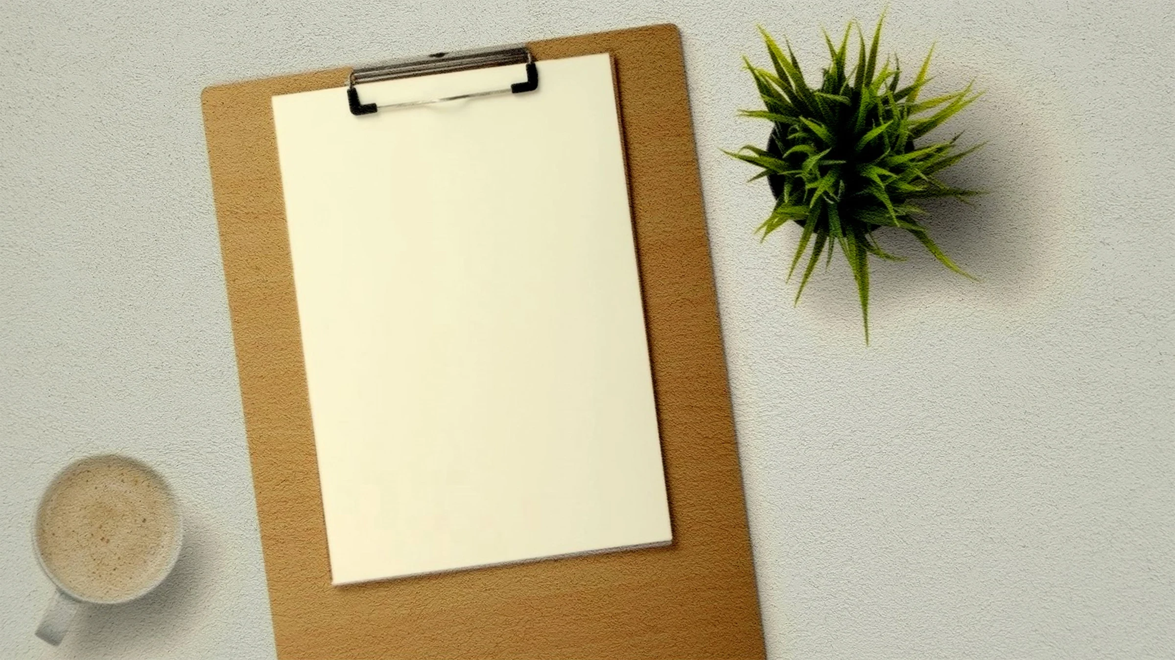 Clipboard with a paper report and stationery arranged on a desk.