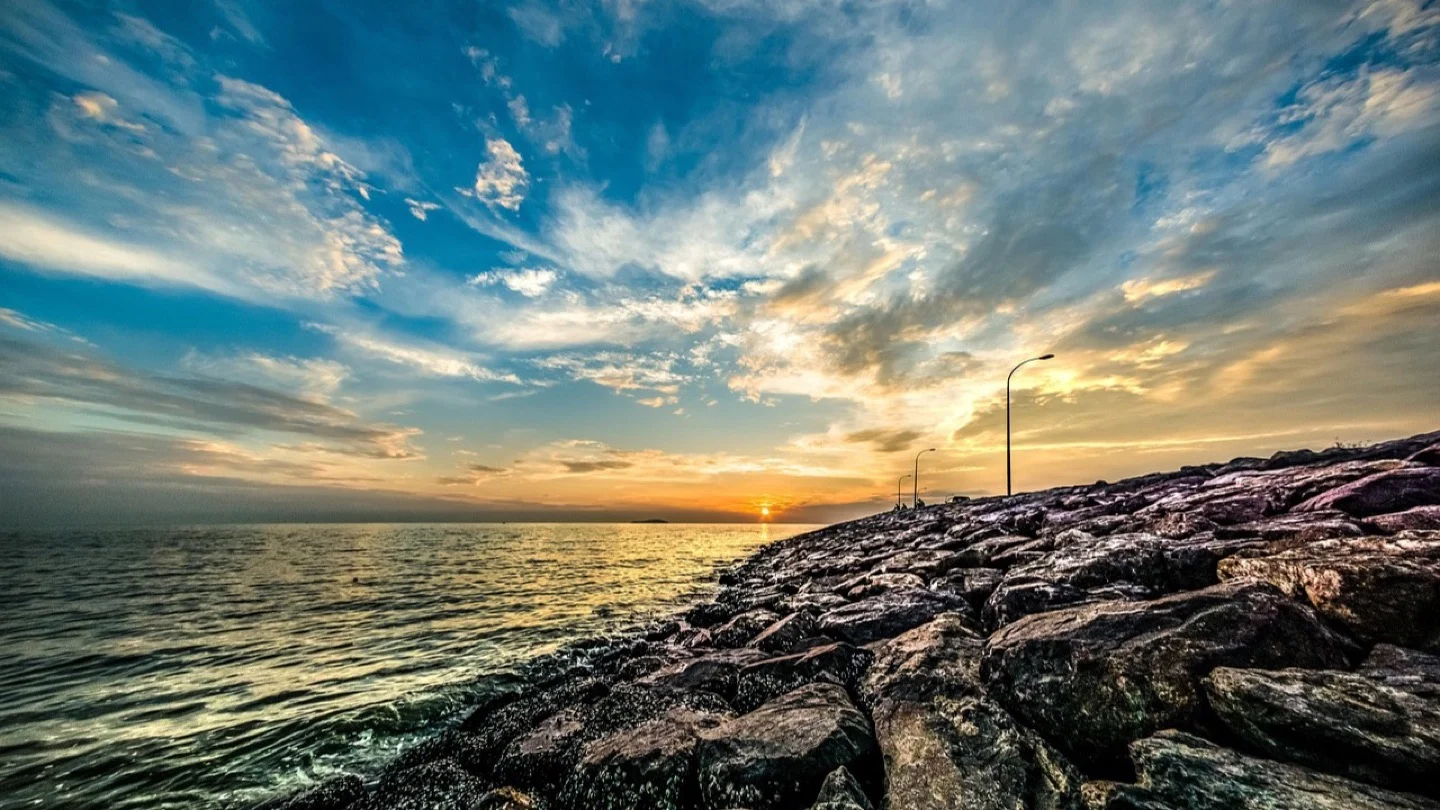 The Johor coastline at Pontian beneath an expansive evening sky.