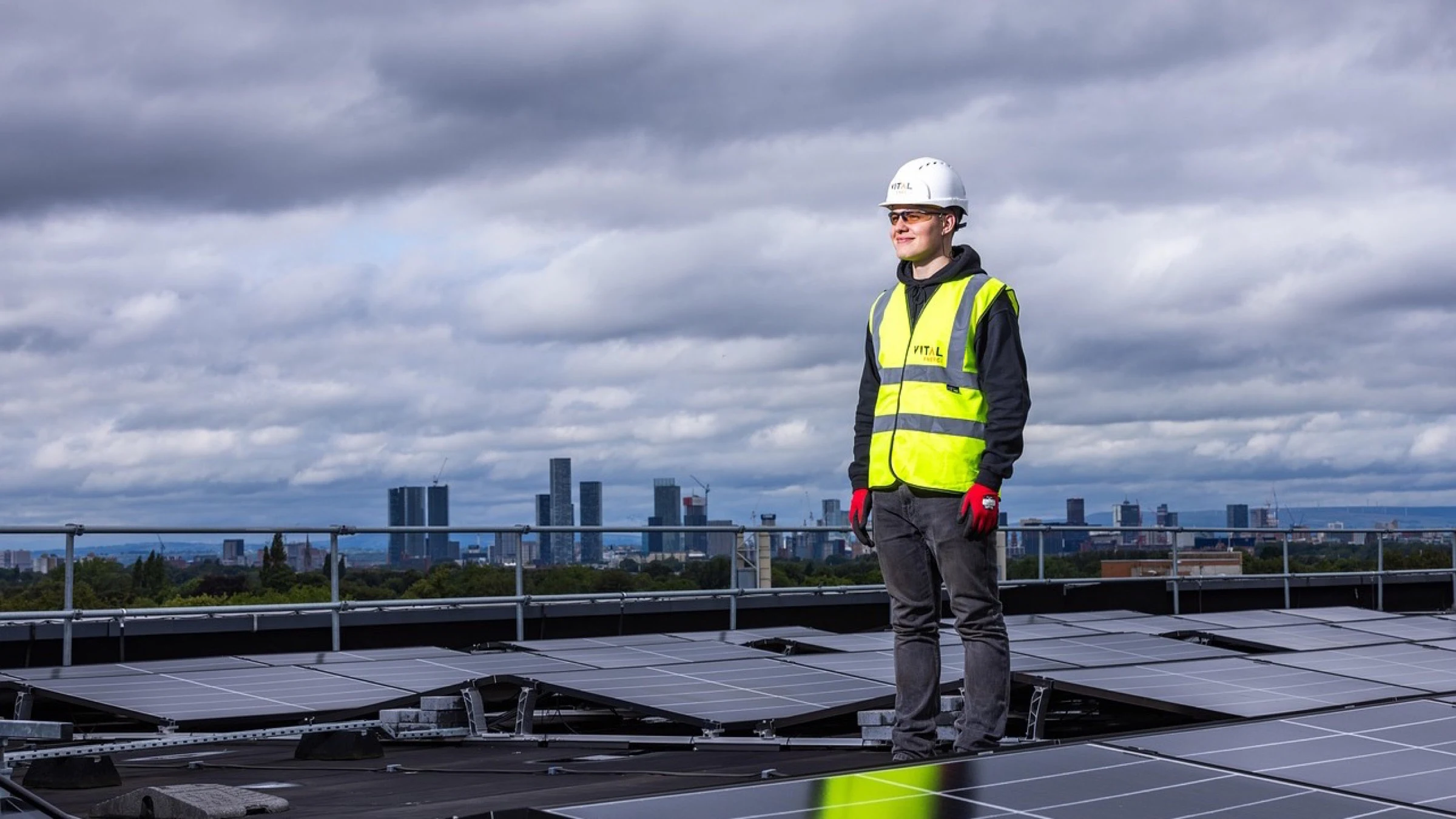 Solar panels being installed on a sloping rooftop.
