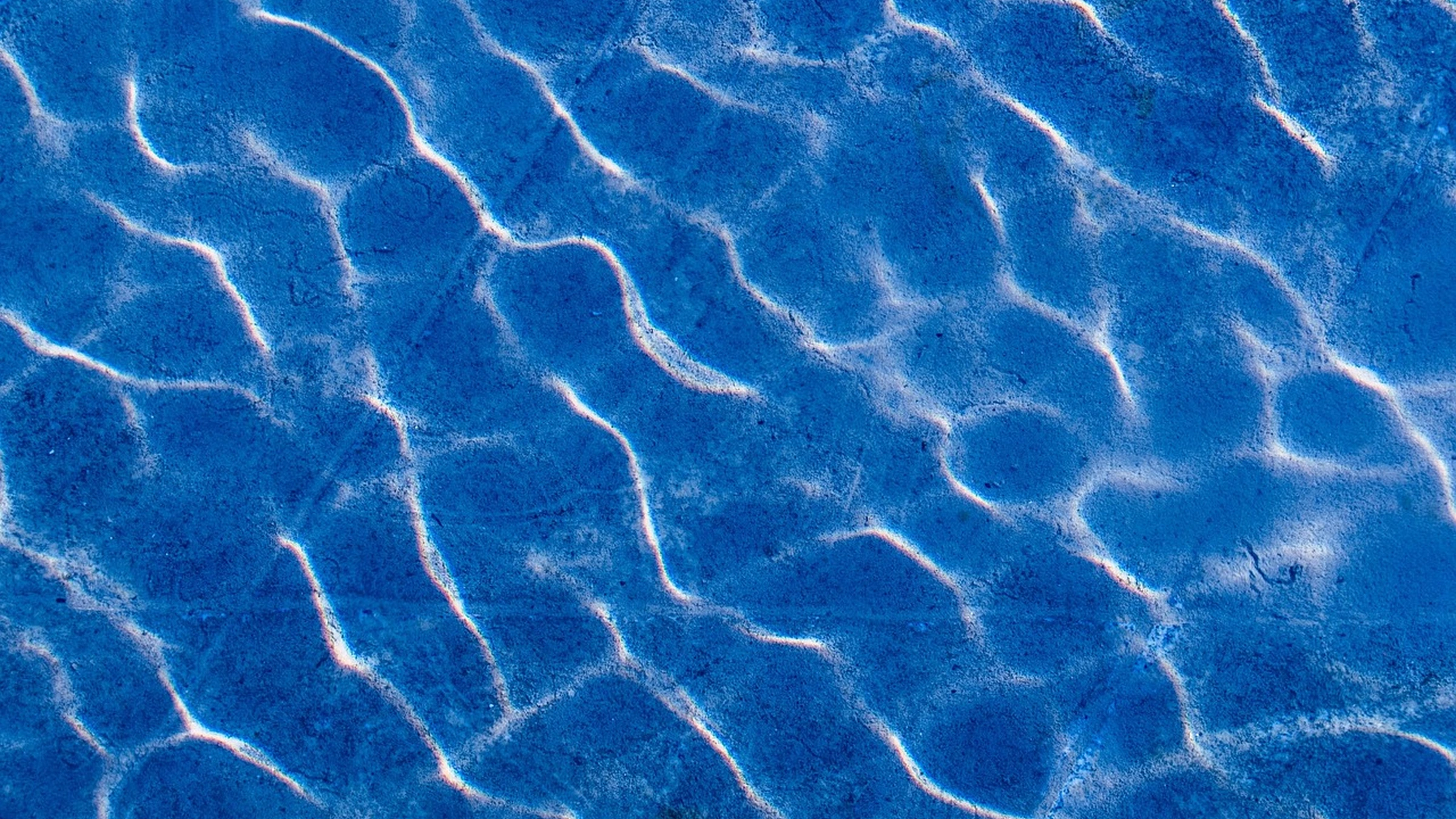Small waves and reflected light across a water surface.