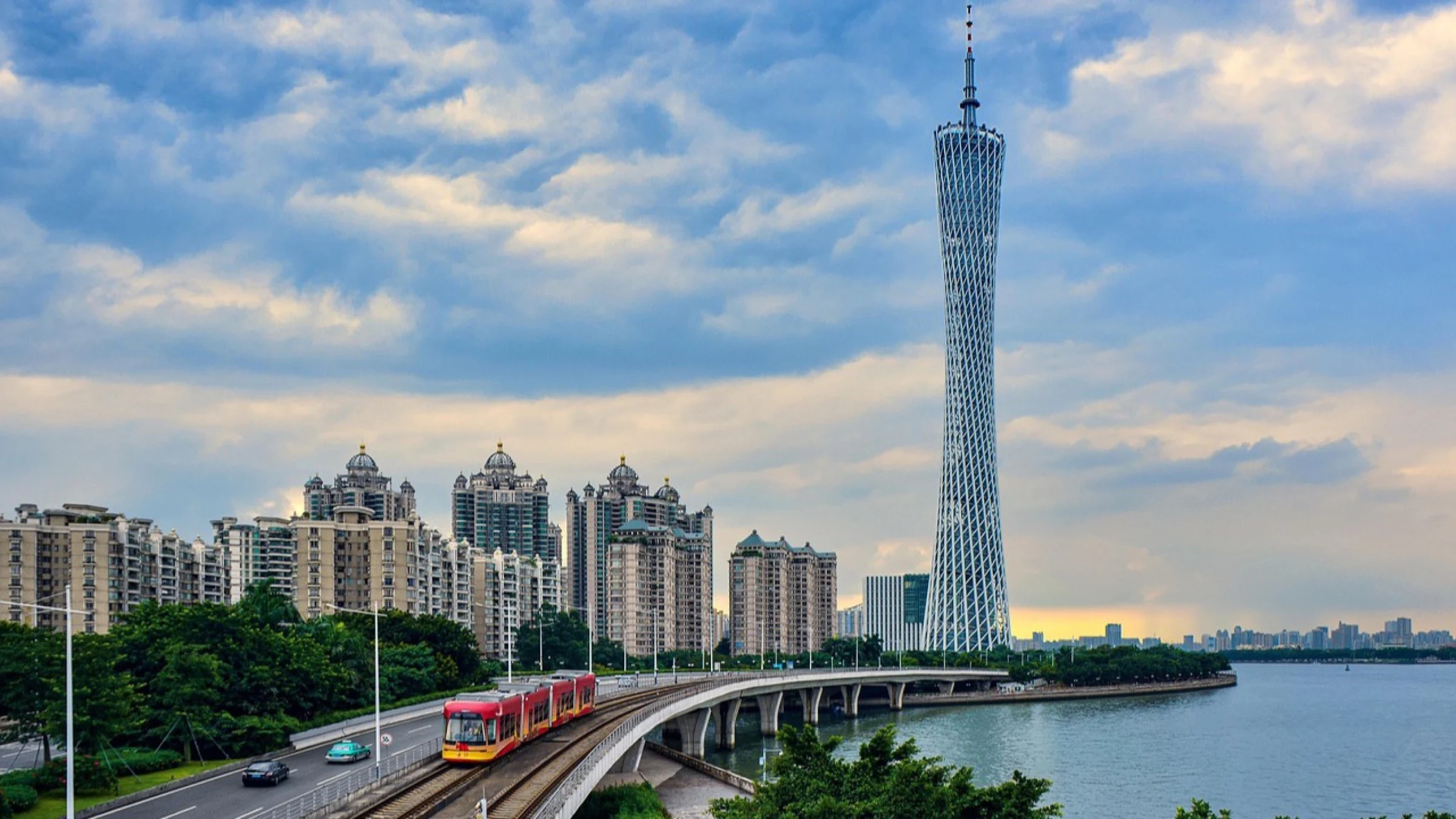 Guangzhou waterfront with the Canton Tower, transport viaduct and river.