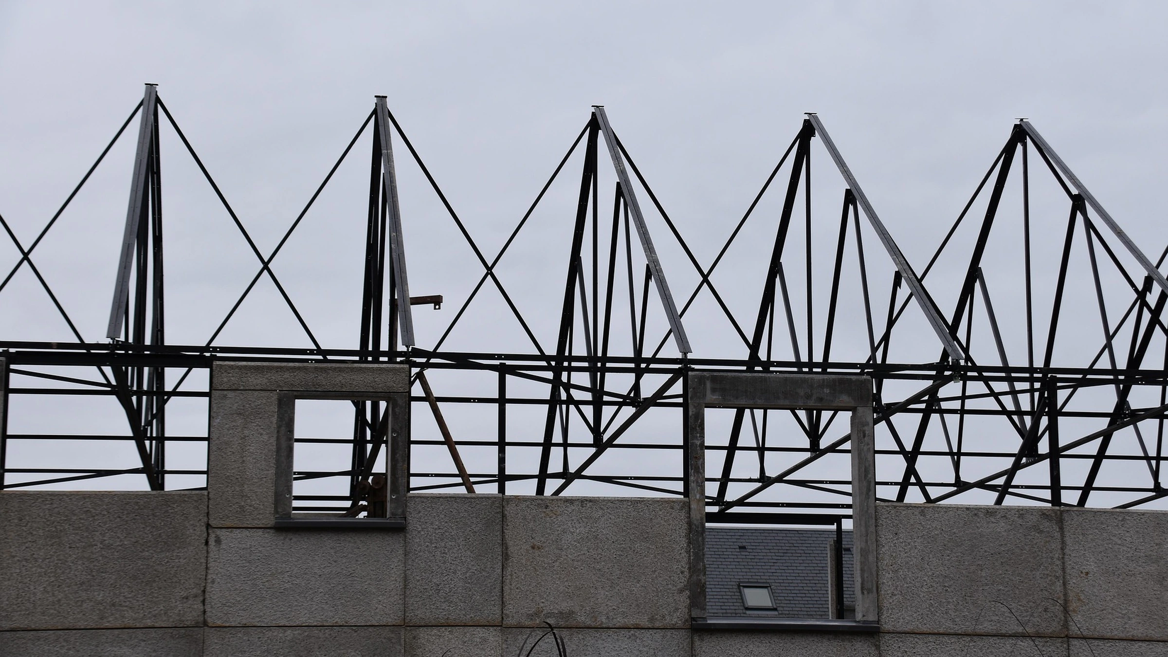 Roof frame above an unfinished house.