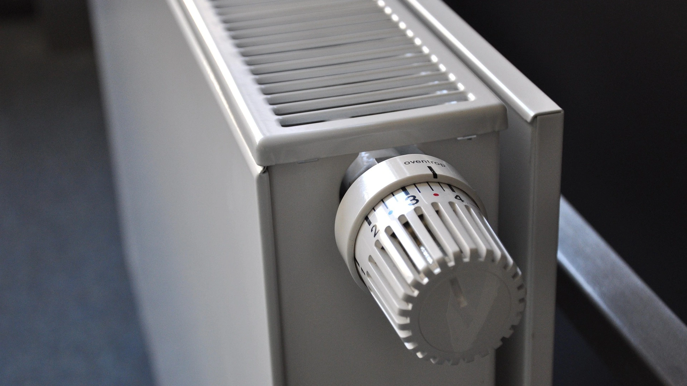 Thermostatic control on a white household radiator