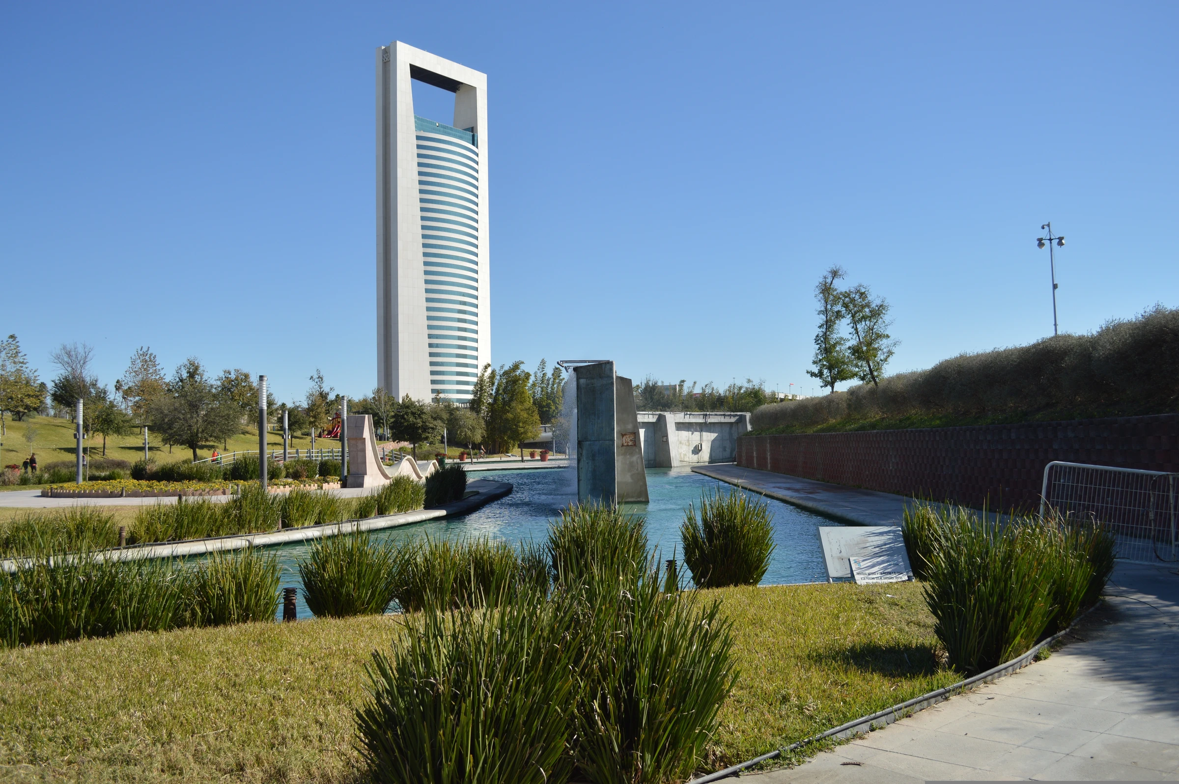 Monterrey skyline and landscaped water feature at Santa Lucía, Mexico.
