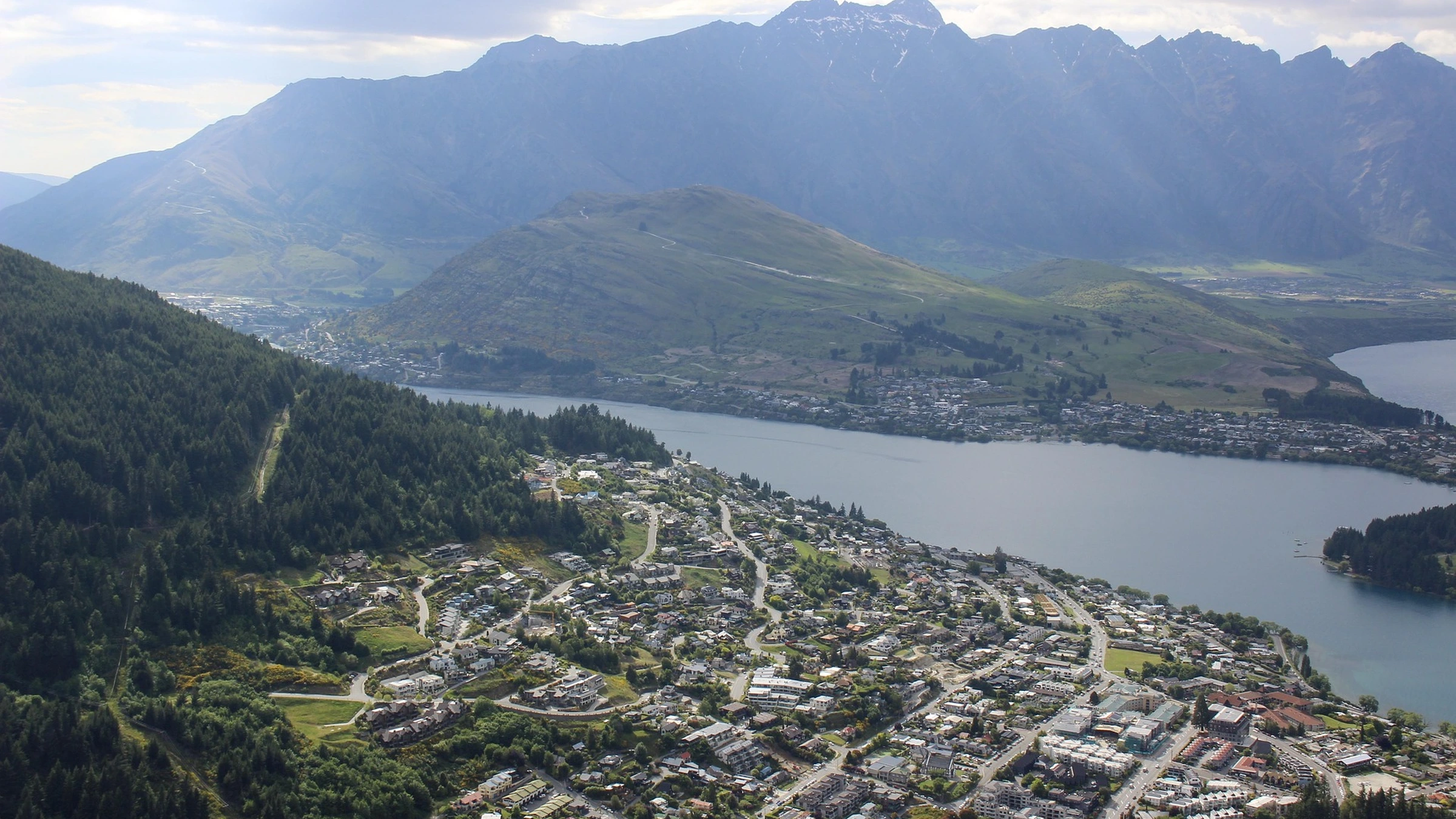 Queenstown homes beside Lake Wakatipu and surrounding mountains