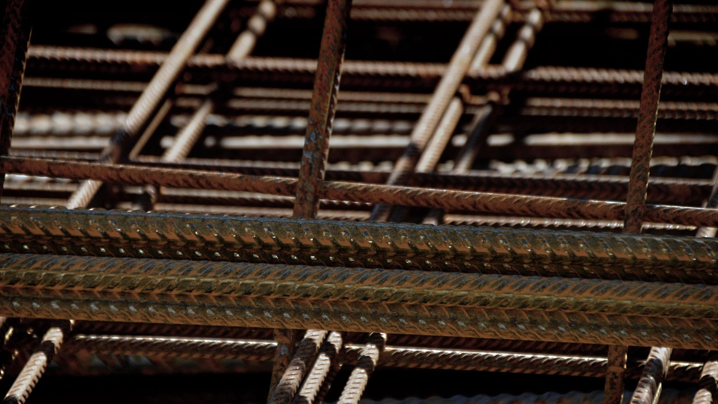 Close view of steel reinforcement bars and mesh.