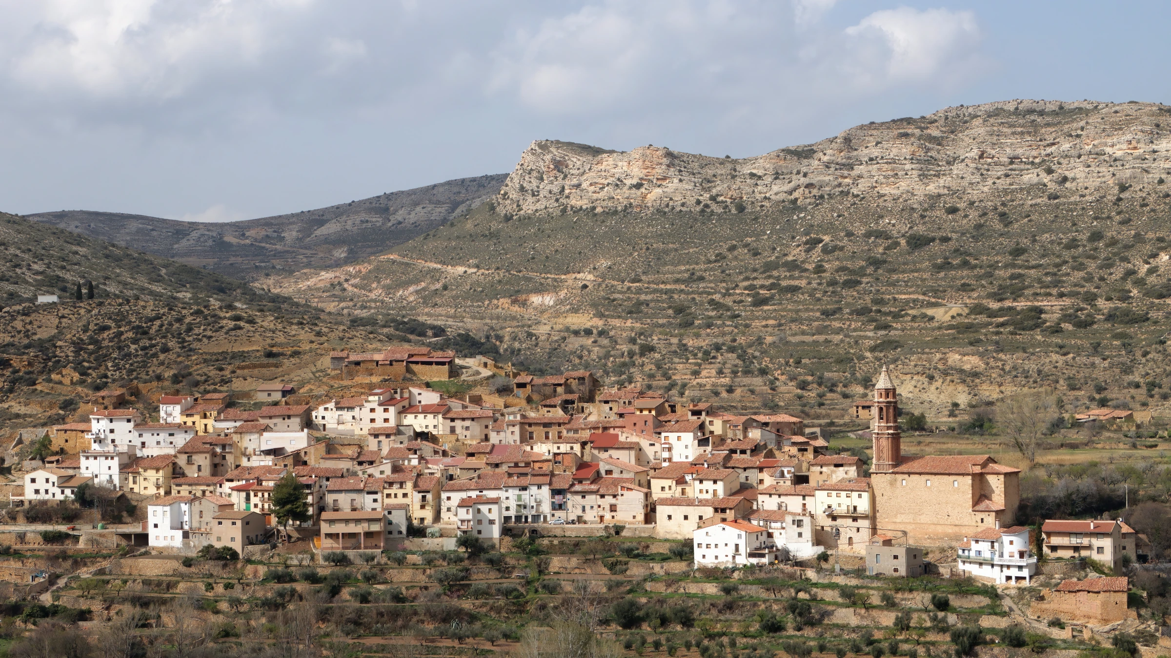 A Spanish village below dry hills in Teruel
